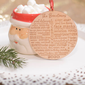 Typography Quarantine Ornament leaning on Cup of Hot Cocoa
