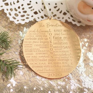 Typography Pandemic Christmas ornament on a gold sparkly table cloth