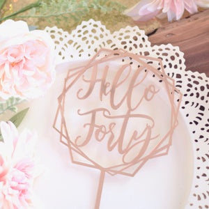 Hello Forty Cake topper on white plate