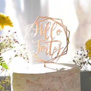Hello Forty Birthday Cake Topper on a white cake