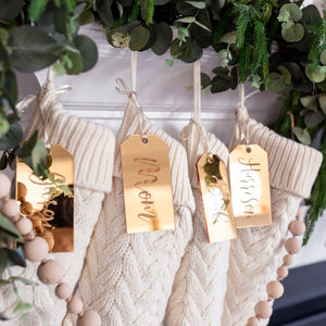 Gold Customized Stocking Name Tags on a White mantel