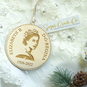 Wooden Queen Elizabeth Christmas tree ornament with a tag saying Sugar Crush Co Handcrafted in Canada