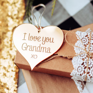 I Love you grandma ornament lying on a gift box