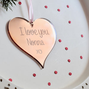 Gift for Nonna rose gold ornament on a cake plate