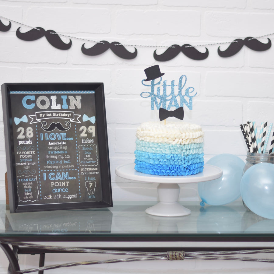 Blue and black little man cake topper on blue ombre cake