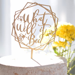 Geometric Gender Reveal Cake Topper on a white cake and yellow flowers