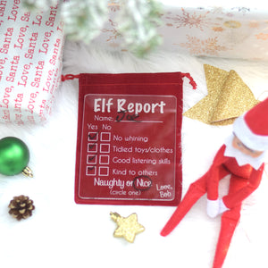 Elf Report with child's name dry erase board on a red velvet bag