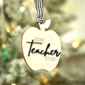 White and black best teacher ever Christmas ornament with buffalo check ribbon