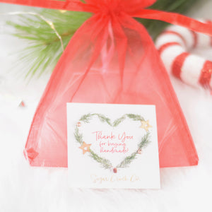 Red organza bag with a thank you card