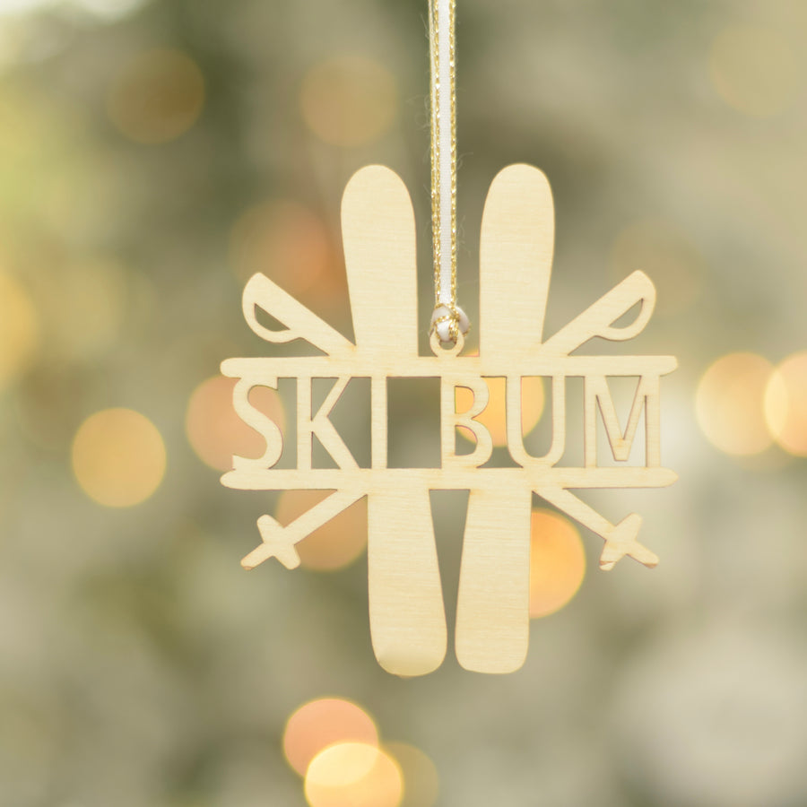 Ski Bum Christmas Tree Ornament on a flocked tree