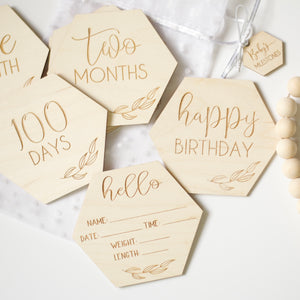 Baby milestone disks, showing baby stats, happy birthday, 100 days, and two months.
