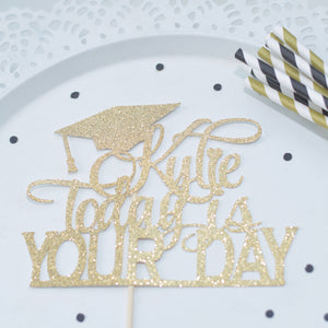 Black and gold graduation decorations straws and cake topper with confetti