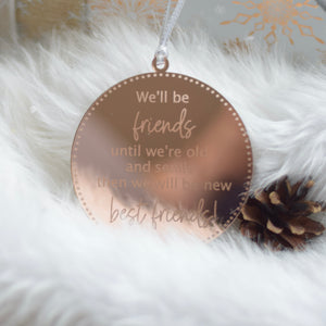 Mirrored Rose Gold Bestie ornament on furry Christmas tree skirt