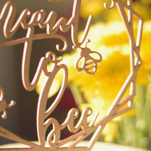 close up image of bumble bee on wedding cake topper