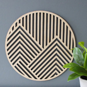 Round laser cut mountain wall art with a midcentury vibe