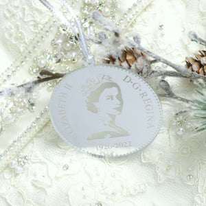 Silver Queen Elizabeth II Christmas tree ornament, appears as a replica of the back of a nickel or dime.