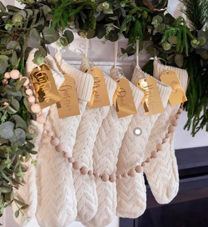 White knit stockings and gold stocking tags