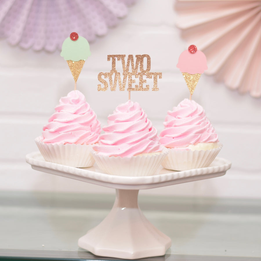 two sweet cupcake toppers on pink cupcakes