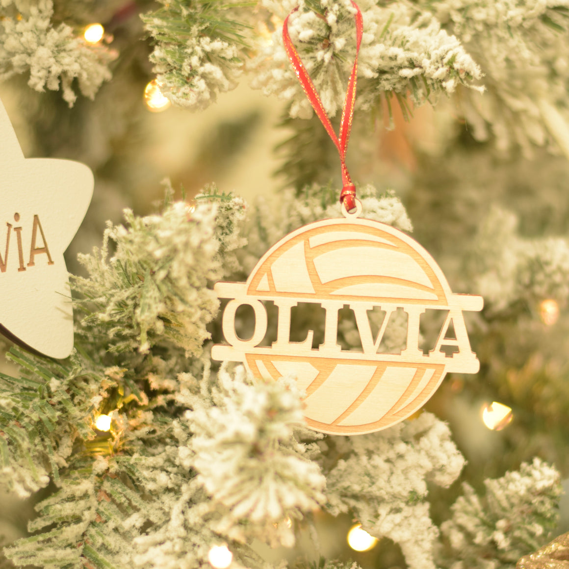 Personalized Volleyball Ornament on a Flocked Christmas Tree
