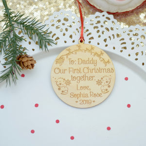 To Daddy Our first Christmas together ornament on a white plate
