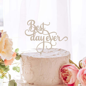 Best day ever in a swirly font on a white wedding cake