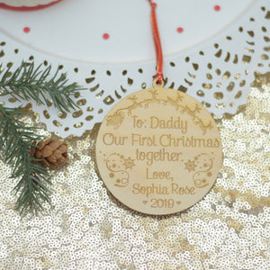 Christmas ornament for new dad with Santa and sleigh with Christmas greenery