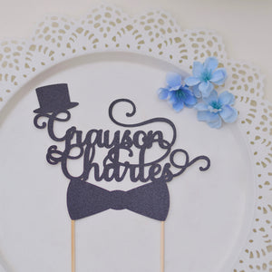 Personalized Mr Onederful cake topper with top hat and bowtie on a plate with blue flowers