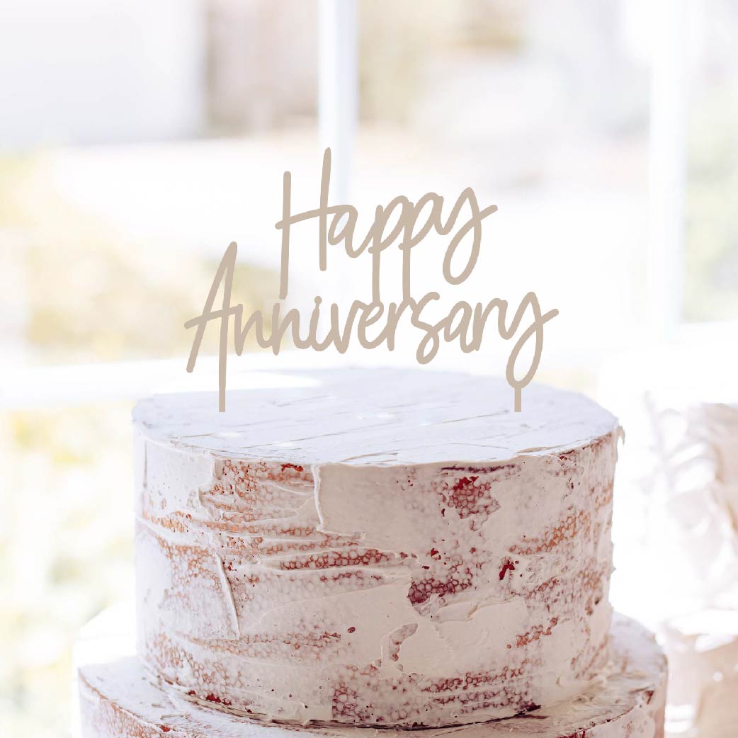 Happy Anniversary Cake topper on a white cake