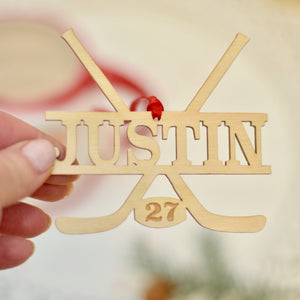 Lady holding a personalized hockey ornament