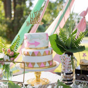 Wild one cake topper on fun boho inspired cake and table