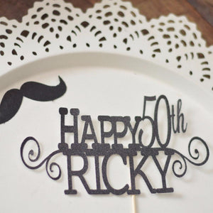 Happy 50th Ricky intricate and detailed black cake topper on white background with mustache cutout