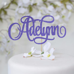 Adelynn purple sparkly giltter cake topper on white cake