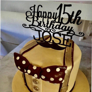 Happy 15th Birthday Jose black mustache cake topper on gold and black cake with suspenders and bowtie