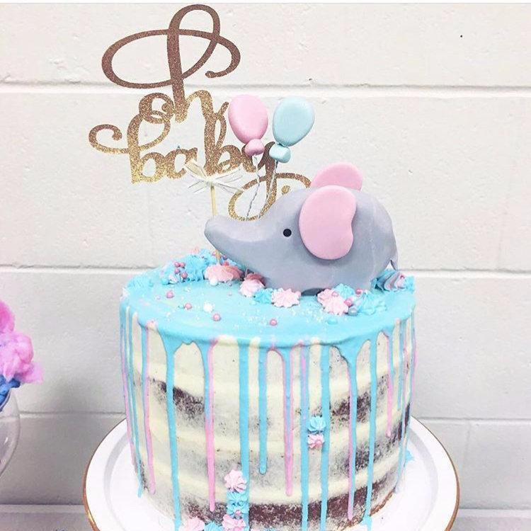 Oh baby sparkly glitter cake topper on cute elephant baby cake
