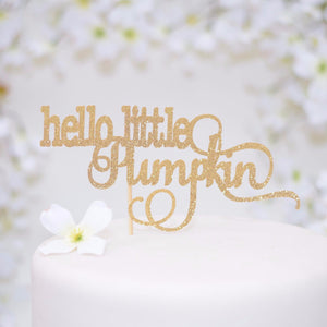 Hello little pumpkin gold sparkle glitter topper on white cake with flowers