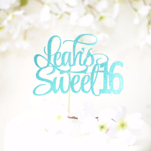 Leah's sweet 16 teal sparkle glitter cake topper on white cake with flower details