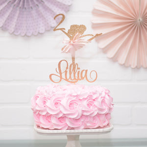 gold ballerina on pink cake