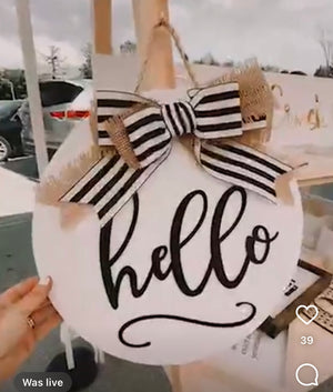 hello front door sign with a big bow