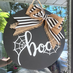 Black and white boo sign with a burlap and striped bow, perfect for fall and Halloween front door decor. 