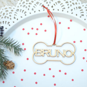 Bruno Christmas Tree ornament on a cake plate with red confetti