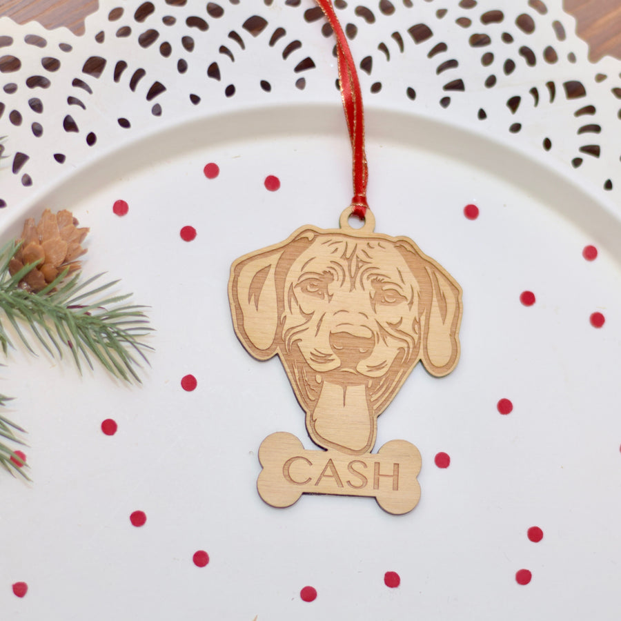 Rhodesian Ridgeback Wooden Christmas ornament on a cake plate with confetti