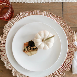 Thanksgiving place setting with white pumpkin and gold place setting